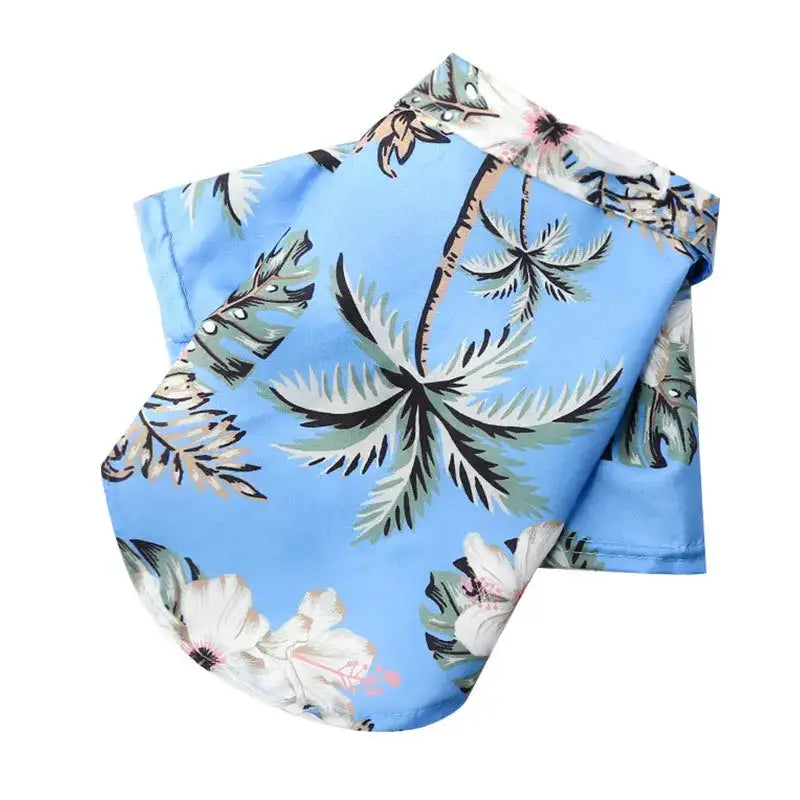 Camisa hawaiana para perro celeste con palmeras verdes